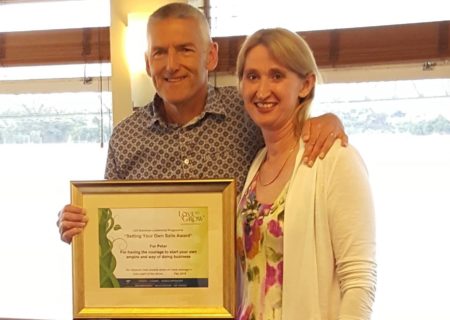 Trish Love and a recognition award